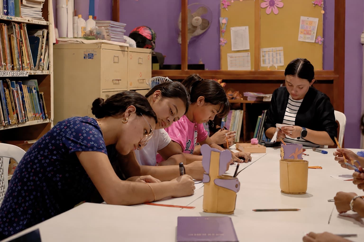 Students writing to their sponsors at the center in Jinotega